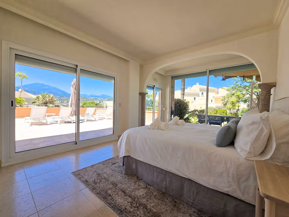 Open-plan kitchen and dining area in a managed Marbella home